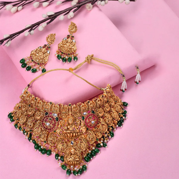 http://13.235.91.190/products/gold-plated-kemp-stone-studded-lakshmi-design-with-dangling-green-beads-choker-set