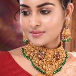 Gold Plated Kemp Stone Studded Lakshmi Design With Dangling Green Beads Choker Set